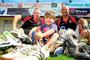 Cobras give needy kids the boots
